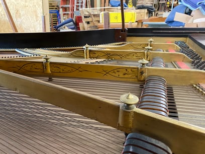 The beautiful inteior of an 1896 piano.