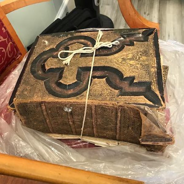book repair restoration: black and gold bible spine before