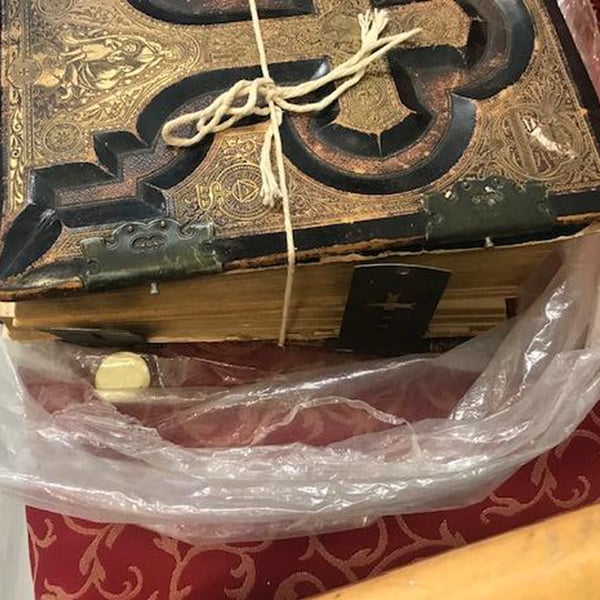book repair restoration: black and gold bible text block before